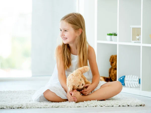 Girl hugging teddy bear — Stock Photo, Image