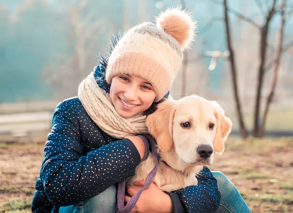 Beautiful girl hugging dog — Stock Photo, Image