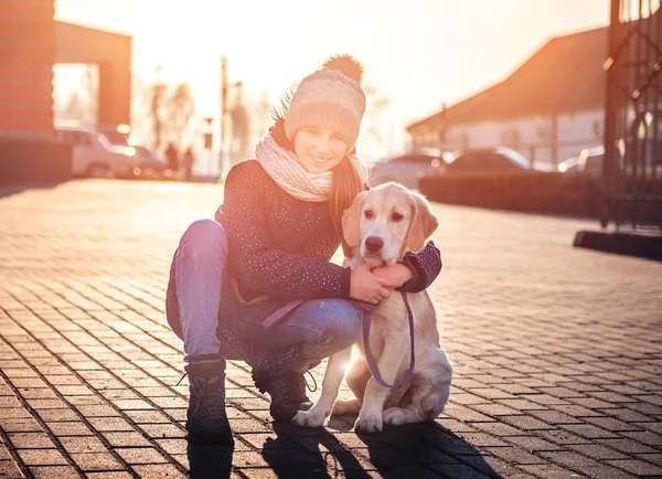 Cute girl hugging beautiful dog — 스톡 사진