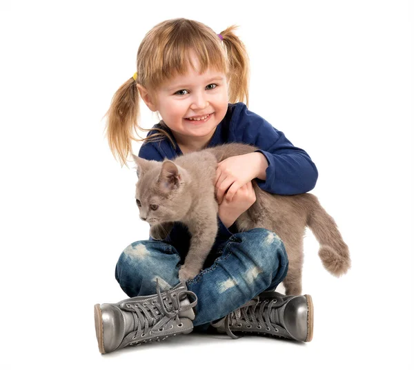 Cute little girl with cat in hands Stock Photo