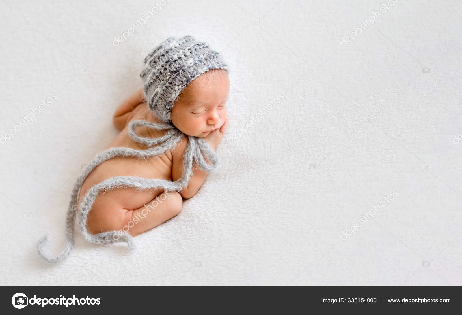 Cute newly arrived baby lying, wrapped in blanket Stock Photo by ©tan4ikk  335154000