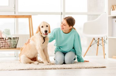 Cheerful girl with sweet dog