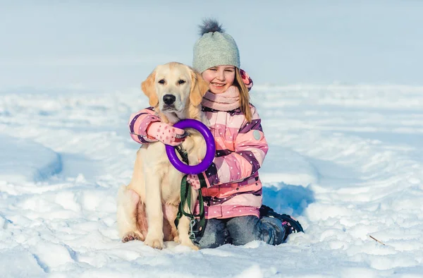 Girl sitting next to dog — Stock Photo, Image