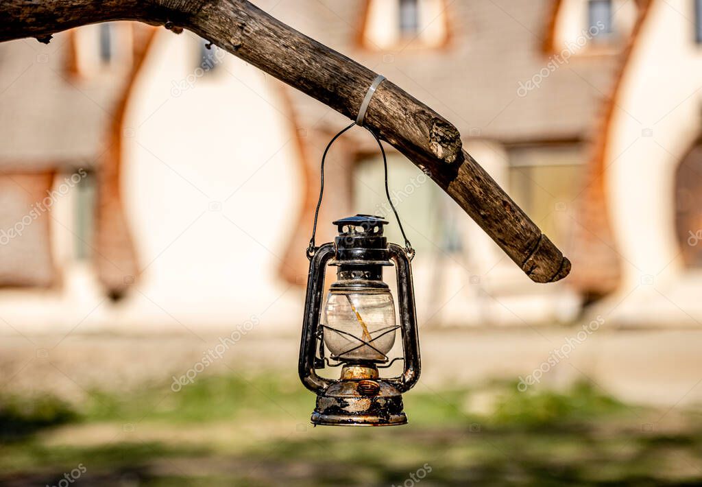 Old lantern hanging on branch