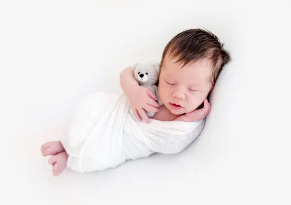 Adorable newborn in white blanket — Stock Photo, Image