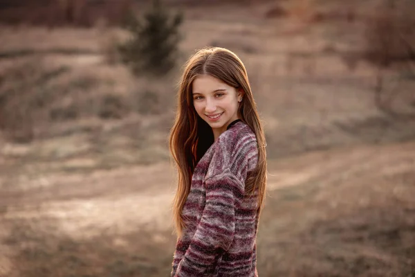 Girl with sun in fluttering hair — Stock Photo, Image