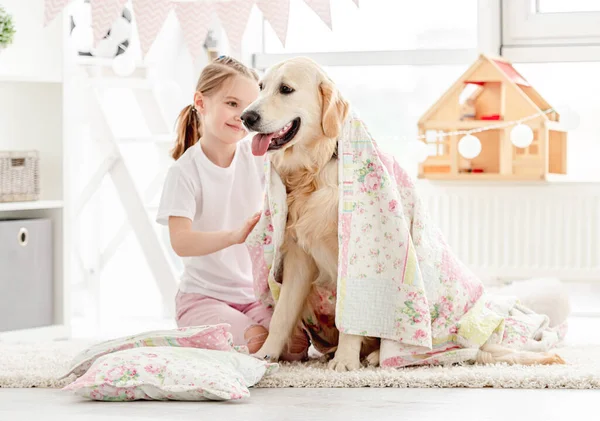 Beautiful little girl covering cute dog — Stock Photo, Image