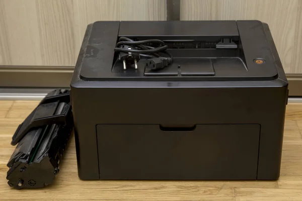 Old office laser printer with cartridge