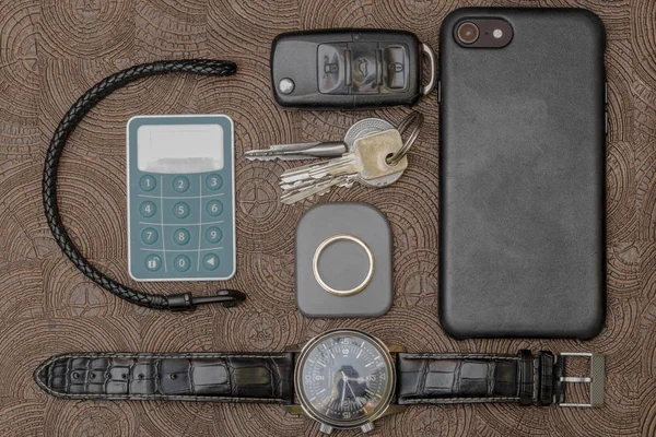 A business man leather accessory, closeup. Wallet, strap, handstrap and mobile phone with case — Stock Photo, Image