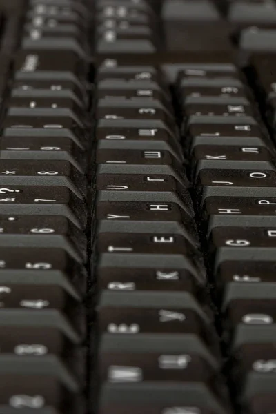 Zwarte toetsenbord close-up. Toetsenbord patroon. Horizontale patroon. Verticale patroon. — Stockfoto