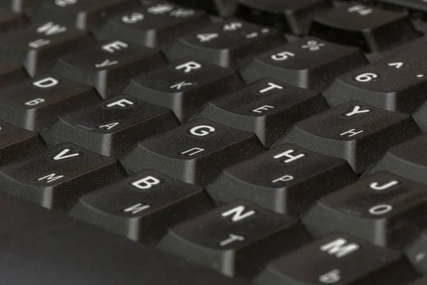 Zwarte toetsenbord close-up. Toetsenbord patroon. Horizontale patroon. Verticale patroon. — Stockfoto
