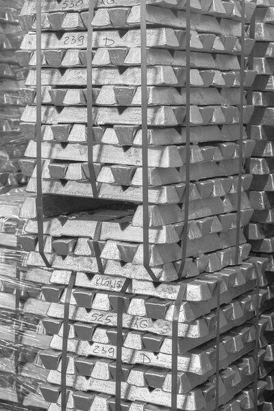 Close up of Aluminum on pallet Ingot storage in indoor warehouse for export as industrial background. Aluminium bullion on pallet. Black and White Pattern, texture