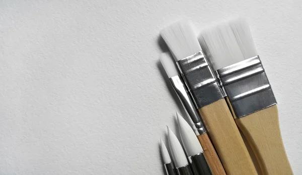 Brush on a watercolor pape — Stock Photo, Image