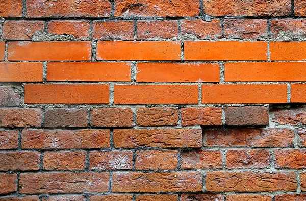 Old wall with ancient and new bricks — Stock Photo, Image