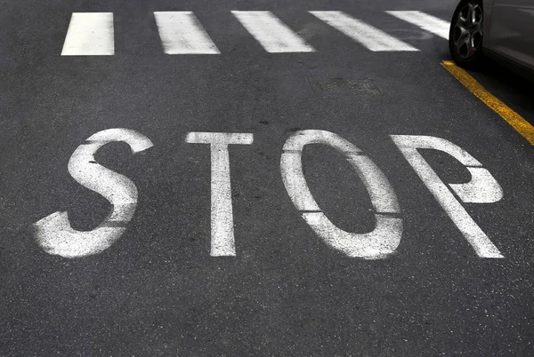 City crosswalk with symbol stop — Stock Photo, Image