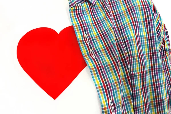 Closeup of T-shirt with a red heart under colorful unbuttoned sh — Stock Photo, Image