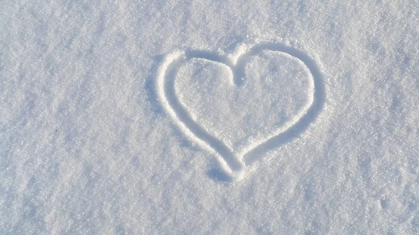 Draw of heart on the white snow — Stock Photo, Image