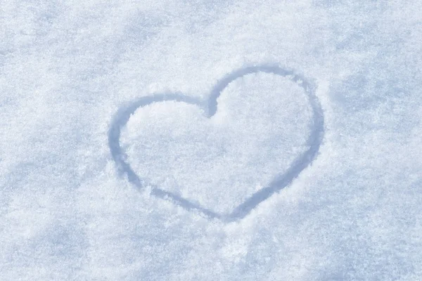 The shape of heart painted on the snow — Stock Photo, Image