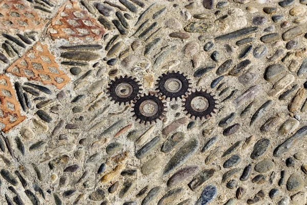 Unusual floor with pattern from pebbles, brick and rusty metal d — Stock Photo, Image