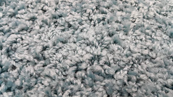 Nieuwe grijze tapijt close-up textuur — Stockfoto