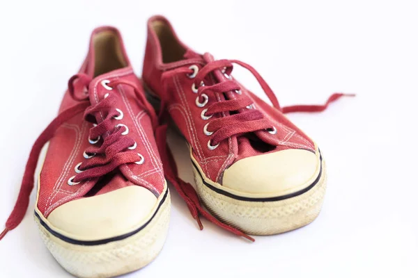 Old sneakers on a white background — Stock Photo, Image