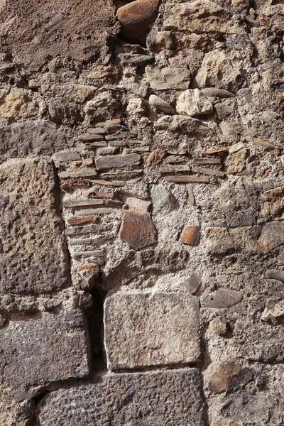 Textura de uma parede velha de pedras e tijolos — Fotografia de Stock