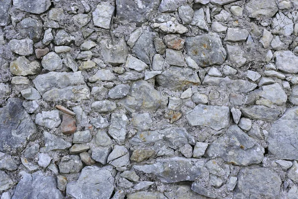 Alte Mauer aus Steinen in verschiedenen Formen — Stockfoto