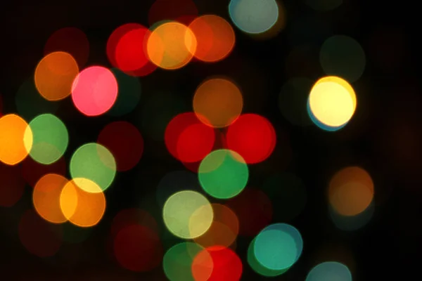 Bunte festliche verschwommene Lichter der Weihnachtsdekoration — Stockfoto