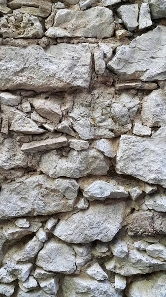 Very old stone wall, close-up architectural texture — 图库照片