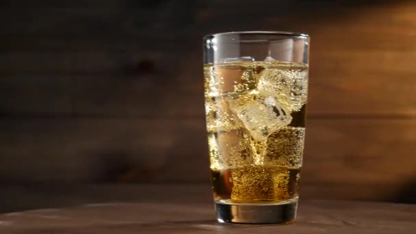 Glass Lemonade Ice Cubes Bubbles Dark Wooden Background Slider Shot — Stock Video