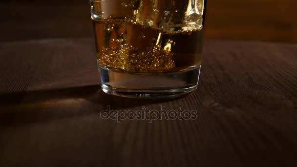 Glass Lemonade Ice Cubes Bubbles Dark Wooden Background — Stock Video