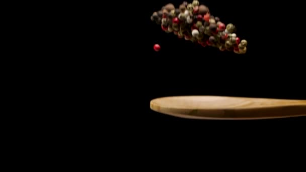 Different pepper in wooden spoon — Stock Video