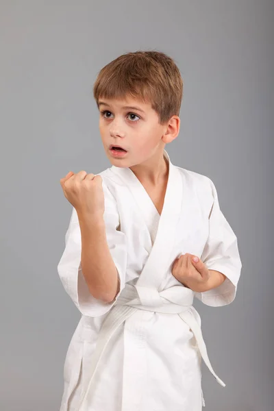 Karate boy in white kimono — Stock Photo, Image