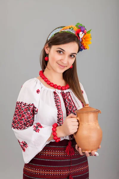 Woman holding jug — Stock Photo, Image