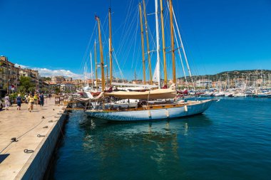Yachts anchored in port in Cannes clipart