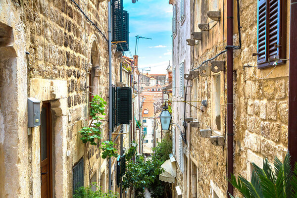 Popular narrow street in Dubrovnik in a beautiful summer day, Croatia