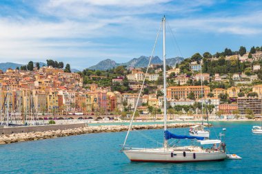 Colorful old town and beach in Menton clipart
