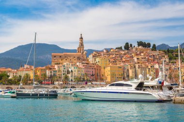 Colorful old town and beach in Menton clipart