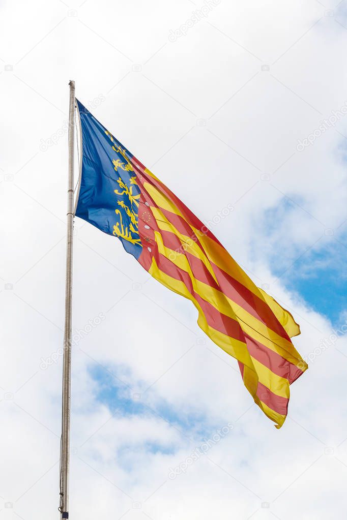 Flag of Valencia against sky
