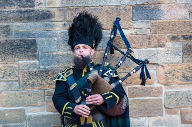 Bagpiper playing music clipart