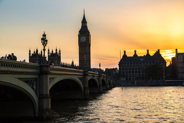 The Big Ben, the Houses of Parliament and Westminster bridge in beautiful summer evening, London, England, United Kingdom