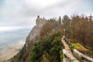 Rocca della Guaita fortress in fog