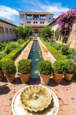 Fountain and gardens in Alhambra clipart
