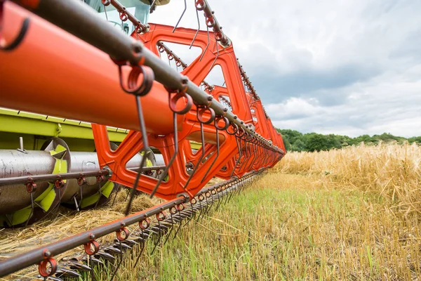 Combine-harvester in a field Royalty Free Stock Images