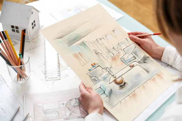 Designer works with hand drawing of interior — Stock Photo, Image