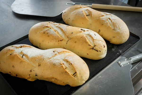 Three hot onion bread loafs — Stock Photo, Image