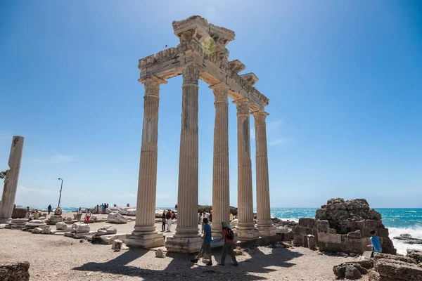 People explore ancient roman ruins of Apollo temple in Side, Tur