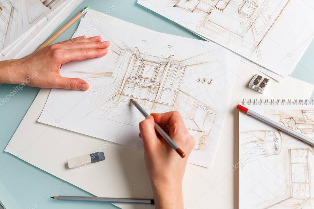 Interior designer making hand drawing pencil sketch of a bathroo