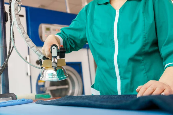 Female Hand Ironing Blue Jeans Dry Cleaning Laundry Service — Stock Photo, Image