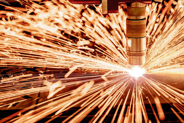 CNC Laser plasma cutting of metal, modern industrial technology.